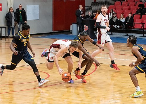 JESSICA LEE / WINNIPEG FREE PRESS

University of Winnipeg Wesmen player Mikhail Mikhailov (14) dribbles the ball during a game against the University of Brandon Bobcats at Duckworth Centre on December 29, 2022.

Reporter: Mike Sawatzky