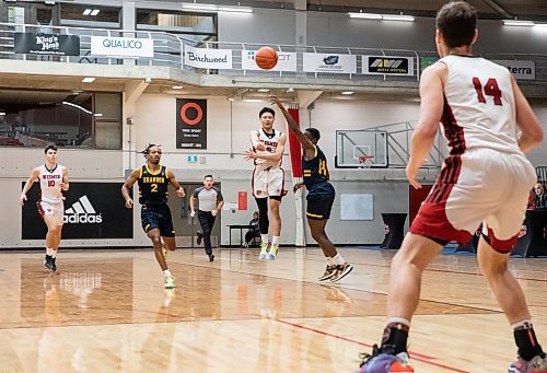 JESSICA LEE / WINNIPEG FREE PRESS

University of Winnipeg Wesmen player Paul Francisco (8) passes the ball to teammate Mikhail Mikhailov (14) during a game against the University of Brandon Bobcats at Duckworth Centre on December 29, 2022.

Reporter: Mike Sawatzky