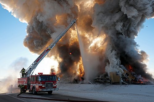 Brandon Fire and Emergency Services members battle a large fire that destroyed an apartment complex under construction on Victoria Avenue and 42nd Street in Brandon on a bitterly cold morning. Smoke from the blaze could be seen from across the city as it towered up into the clear sky. (Tim Smith/The Brandon Sun)