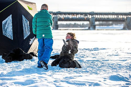 MIKAELA MACKENZIE / WINNIPEG FREE PRESS

Laine Hansen, eight, has a fish fight with a friend using fresh-caught sauger as weapons at an ice fishing village on the river in Lockport on Friday, Dec. 30, 2022. For Malak story.
Winnipeg Free Press 2022.