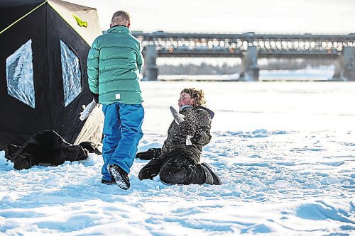 MIKAELA MACKENZIE / WINNIPEG FREE PRESS

Laine Hansen, eight, has a fish fight with a friend using fresh-caught sauger as weapons at an ice fishing village on the river in Lockport on Friday, Dec. 30, 2022. For Malak story.
Winnipeg Free Press 2022.