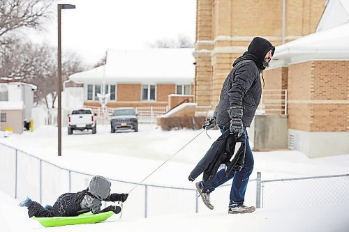 30122022
Jason Hlady pulls his four-year-old son up the hill at Rideau Park in a sled while the two toboggan together on an overcast Friday afternoon. (Tim Smith/The Brandon Sun)