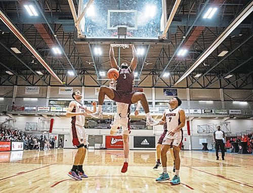 JESSICA LEE / WINNIPEG FREE PRESS

University of Ottawa Gee-Gees player Josh Inkumasah dunks the ball during a game against the University of Winnipeg Wesmen at the Duckworth Centre on December 30, 2022

Reporter: Mike Sawatzky