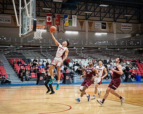 JESSICA LEE / WINNIPEG FREE PRESS

University of Winnipeg Wesmen player Malachi Alexander shoots the ball during a game against the University of Ottawa Gee-Gees at the Duckworth Centre on December 30, 2022

Reporter: Mike Sawatzky