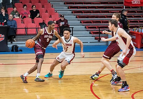 JESSICA LEE / WINNIPEG FREE PRESS

University of Ottawa Gee-Gees player Kevin Otoo dribbles the ball during a game against the University of Winnipeg Wesmen at the Duckworth Centre on December 30, 2022

Reporter: Mike Sawatzky