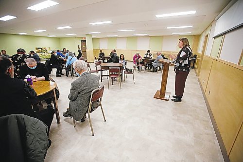 JOHN WOODS / WINNIPEG FREE PRESS
Reverend Lesley Harrison prays with parishioners at a community meal after a service at Knox United Church in Winnipeg Sunday, December 18, 2022. Knox United Church is an intercultural church and community hub in the heart of the Central Park neighbourhood of Winnipeg.

Re: Marten