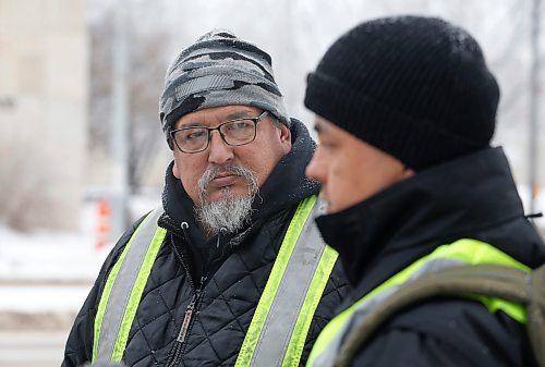JOHN WOODS / WINNIPEG FREE PRESS
Darryl Contois, left, listens as George Robinson speaks to media before they distribute posters to help identify Buffalo Woman, an unidentified person who police have said was killed by an alleged serial killer in Winnipeg, on Main Street near Higgins Sunday, January 1, 2023. The hope is to gain information from the local community that will help identify Buffalo Woman.

Re: pindera