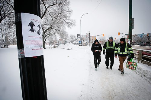 JOHN WOODS / WINNIPEG FREE PRESS
George Robinson right, and Darryl Contois, centre, distribute posters to help identify Buffalo Woman, an unidentified person who police have said was killed by an alleged serial killer in Winnipeg, on Main Street near Higgins Sunday, January 1, 2023. The hope is to gain information from the local community that will help identify Buffalo Woman.

Re: pindera
