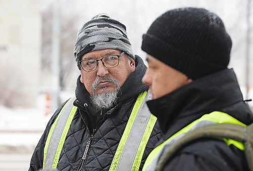 JOHN WOODS / WINNIPEG FREE PRESS
Darryl Contois, left, listens as George Robinson speaks to media before they distribute posters to help identify Buffalo Woman, an unidentified person who police have said was killed by an alleged serial killer in Winnipeg, on Main Street near Higgins Sunday, January 1, 2023. The hope is to gain information from the local community that will help identify Buffalo Woman.

Re: pindera
