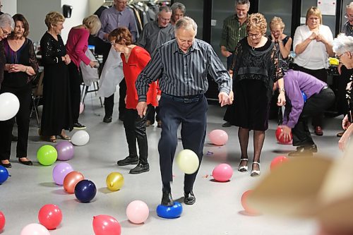 Instead of setting off fireworks, the attendees of Prairie 21's New Year's Eve party, which took place at Brandon Seniors for Seniors Co-op Inc., opted to stomp on some balloons to herald the arrival of 2023. (Photos by Kyle Darbyson/The Brandon Sun)