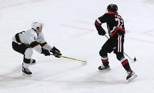 Jagger Firkus (27) of the Moose Jaw Warriors draws his stick back to fire home his second goal as Brandon Wheat Kings defenceman Quinn Mantei (8) defends during the first period of Moose Jaw’s 6-2 win in Western Hockey League action at Westoba Place on Saturday. (Perry Bergson/The Brandon Sun)
