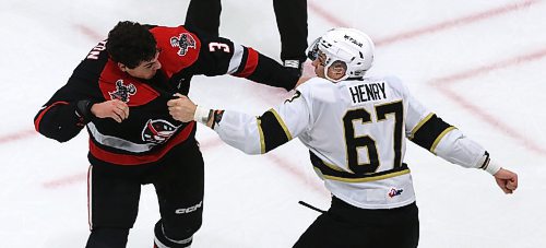 Brandon Wheat Kings forward Matt Henry (67) prepares to throw another punch at Moose Jaw Warriors defenceman Lucas Brenton (3) during a first period tilt in Moose Jaw’s 6-2 victory in Western Hockey League action at Westoba Place on Saturday. (Perry Bergson/The Brandon Sun)