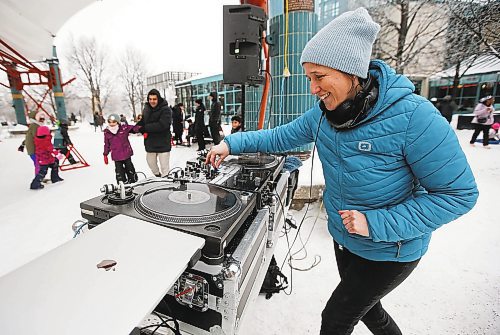 JOHN WOODS / WINNIPEG FREE PRESS
Sarah Michaelson, aka Mama Cutsworth, mixes tunes for skaters as they take part in Arctic Glacier Winter Park events at the Forks Sunday, January 1, 2023. 

Re: ?