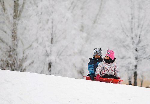 JOHN WOODS / WINNIPEG FREE PRESS
Dax, 7, and Aurelia, 5, slide down a hill with frosty tress as a background as they take part in Arctic Glacier Winter Park events at the Forks Sunday, January 1, 2023. 

Re: ?