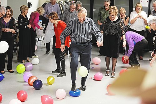 Instead of setting off fireworks, the attendees of Prairie 21's New Year's Eve party, which took place at Brandon Seniors for Seniors Co-op Inc., opted to stomp on some balloons to herald the arrival of 2023. (Photos by Kyle Darbyson/The Brandon Sun)