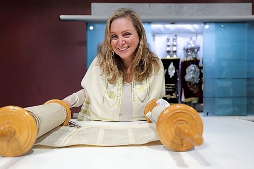 RUTH BONNEVILLE / WINNIPEG FREE PRESS 

FAITH - Basic Judaism

Photos of Rena Sector Elbaze, teacher of course in Basic Judaism, with one of the Torah scrolls open in front of her at Temple Shalom, Thursday. 

Story: Rena Sector Elbaze teaches a five-week Zoom class in basic Judaism for Jews and non-Jews to introduce them to the major tenets of the faith tradition.

Reporter: Brenda Suderman,

Dec 29th,  2022