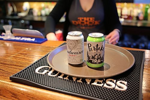 Two non-alcoholic beer that are served at The Dock restaurant in Brandon. Budweiser zero and Partake, an IPA. (Michele McDougall/The Brandon Sun)   