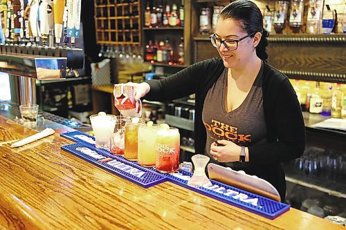Connie Blair, server at The Dock on Princess in Brandon, makes non-alcoholic drinks, also known as mocktails, at the restaurant Tuesday. (Michele McDougall/The Brandon Sun)   