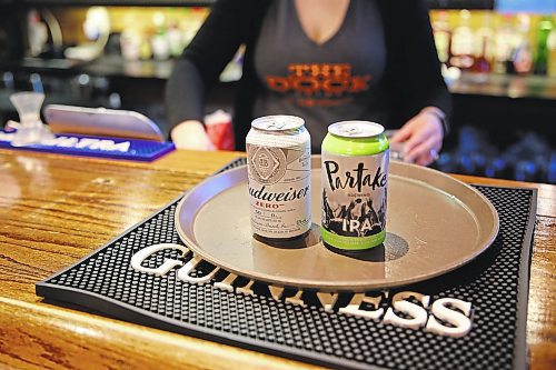 Two non-alcoholic beer that are served at The Dock restaurant in Brandon. Budweiser zero and Partake, an IPA. (Michele McDougall/The Brandon Sun)   