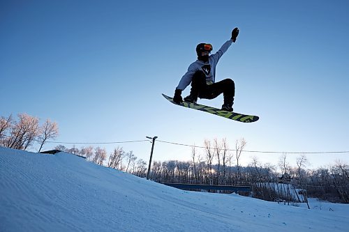 03012023
A snowboarder sails off a box in the terrain park at Asessippi Ski Resort on a sunny Tuesday. (Tim Smith/The Brandon Sun)