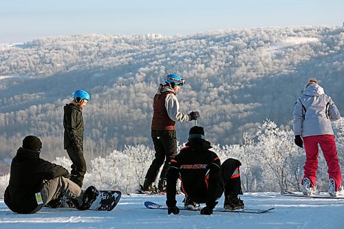 03012023
Snowboarders look put over the hoar frost covered valley while riding the slopes at Asessippi Ski Resort on a crisp Tuesday. (Tim Smith/The Brandon Sun)