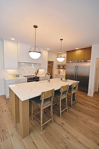 Todd Lewys / Winnipeg Free Press
Style and function merge seamlessly in the stunning island kitchen in this Sage Creek two-storey. 