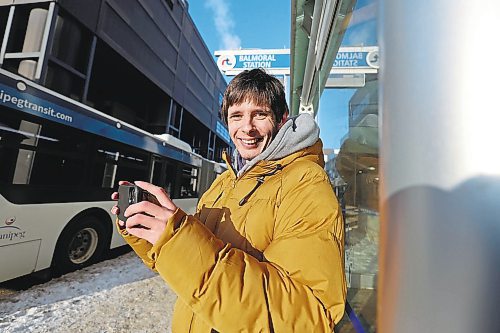 RUTH BONNEVILLE / WINNIPEG FREE PRESS 

ENT - bus spotting

Justin Rombough's hobby is photographing different buses as they leave their bus stops.   This is one a series of photos of him photographing different busses in  downtown Winnipeg Tuesday afternoon.

Story: You're heard of trainspotting? What about busspotting? Justin, 21, has been charting bus routes and snapping pics of public transit busses since he was 14. Since 2017, he has operated an Instagram account to show off his photos. He takes pics on almost daily basis, watching for certain models on certain routes. 

See story. 

Jan 3rd,  2023