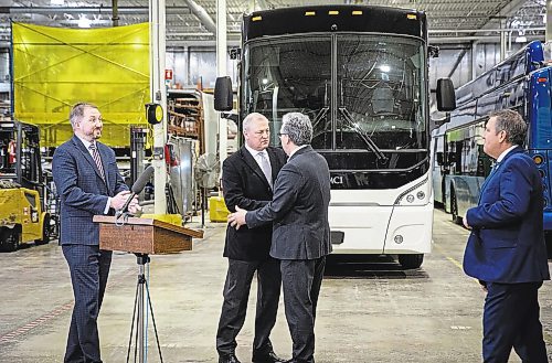JESSICA LEE / WINNIPEG FREE PRESS

CEO and president of New Flyer Industries, Paul Soubry (second from left) and Federal Northern Affairs Minister Dan Vandal (second from right) are photographed during a press announcement of a loan to NFI, at NFI&#x2019;s bus warehouse on December 23, 2022.

Reporter: Danielle Da Silva