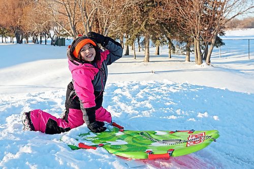 Waverley Elk-Hotain smiles while tobogganing with family at Sioux Valley Dakota Nation on a sunny Wednesday afternoon. (Tim Smith/The Brandon Sun)