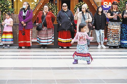 MIKE DEAL / WINNIPEG FREE PRESS
Wabigwan Greene, almost 3-yrs-old, during the first National Ribbon Skirt Day event at the Polo Park Shopping Centre on Wednesday. National Ribbon Skirt Day is held on January 4th a day where Indigenous women across the country are encouraged to wear their traditional regalia to celebrate their culture, their strength and their connection as women.
230104 - Wednesday, January 04, 2023.