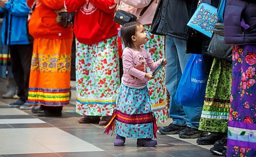 MIKE DEAL / WINNIPEG FREE PRESS
Wabigwan Greene, almost 3-yrs-old, during the first National Ribbon Skirt Day event at the Polo Park Shopping Centre on Wednesday. National Ribbon Skirt Day is held on January 4th a day where Indigenous women across the country are encouraged to wear their traditional regalia to celebrate their culture, their strength and their connection as women.
230104 - Wednesday, January 04, 2023.