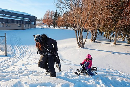 04012023
Arienah Elk pulls her sister Forrest Elk-Hotain up the hill while sledding with family at Sioux Valley Dakota Nation on a sunny Wednesday afternoon. 
(Tim Smith/The Brandon Sun)