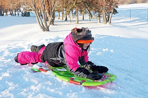 04012023
Waverley Elk-Hotain smiles while tobogganing with family at Sioux Valley Dakota Nation on a sunny Wednesday afternoon. 
(Tim Smith/The Brandon Sun)