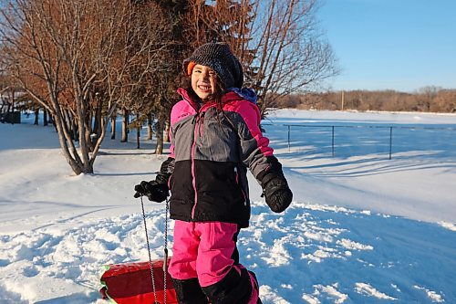 04012023
Waverley Elk-Hotain smiles while tobogganing with family at Sioux Valley Dakota Nation on a sunny Wednesday afternoon. 
(Tim Smith/The Brandon Sun)