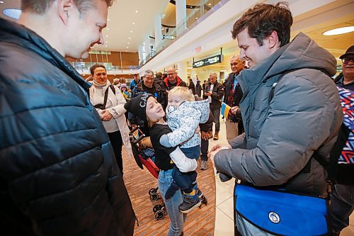 JOHN WOODS / WINNIPEG FREE PRESS
The Veriasov family, consisting of Kate, Dima (right) and their two young sons Dima 4 and Timothy, 18 months (in arms) and Kate&#x2019;s mother Laura (background left) are greeted by Mandy and Ryan (left) Kwasnica, their children, Anya 11 (centre) and Artem 13, and other members of the Charleswood Rotary Club as they arrive at Winnipeg airport Sunday, December 4, 2022. The couple left the Ukraine in March, helping to guide 113 orphaned children from an orphanage in the Ukraine at the direction of the Ukrainian government, to a safe place in Poland due to the war. Upon ensuring the children were safe in Poland, the family applied for refugee status here in Canada. The Charleswood Rotary Club &amp; supporters undertook a plan last April to support the relocation of a Ukrainian War Refugee family to Winnipeg. The Veriasov family have been waiting in Poland since April of this year for the IRCC to process the necessary application papers

Re: ?
