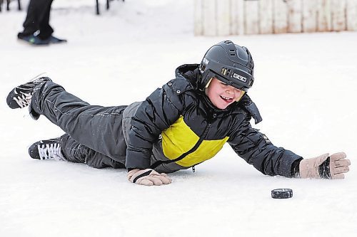 05012023
Callum Westfall-Nelson lunges to stop the puck while playing with family and friends at the Central Community Club rink on a cold Thursday in Brandon.
(Tim Smith/The Brandon Sun)