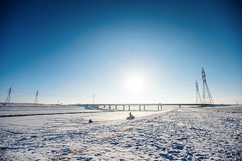 MIKAELA MACKENZIE / WINNIPEG FREE PRESS

Dale LaMonica (left) and Mark Olford snowmobile back to their trucks, after sledding to Niverville and back, on the Duff Roblin Parkway just outside of Winnipeg on Thursday, Jan. 5, 2023. Standup.
Winnipeg Free Press 2023.