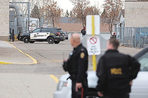 01112022
Brandon Police Service members secure the area around Crocus Plains Regional Secondary School during a lockdown and search of the school on Tuesday Morning in relation to reports of people with guns near the school.
(Tim Smith/The Brandon Sun)