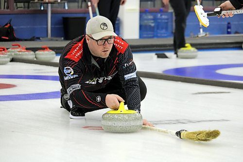 Third James Hay delivers a rock for Jay Kinnaird's rink from Virden during the opening draw of the Brandon men's competitive bonspiel at the Brandon Curling Club on Friday night. (Lucas Punkari/The Brandon Sun)