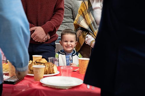 JESSICA LEE / WINNIPEG FREE PRESS

Dmytro Kashchak, 4, smiles as he celebrates Ukrainian Christmas Eve with his family on January 6, 2023 at Sts.Vladimir and Olga Cathedral. 200 newcomers gathered at the cathedral.

Reporter: Maggie Macintosh