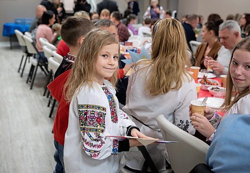 JESSICA LEE / WINNIPEG FREE PRESS

Veronica Derenko, 7, is photographed celebrating Ukrainian Christmas Eve with her family on January 6, 2023 at Sts.Vladimir and Olga Cathedral. 200 newcomers gathered at the cathedral.

Reporter: Maggie Macintosh