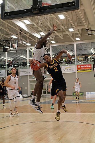 Jahmaal Gardner of the Brandon Bobcats tries to draw a foul on UBC forward Tobi Akinkunmi. (Thomas Friesen/The Brandon Sun)