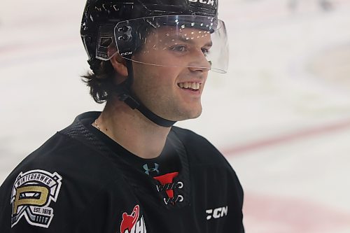 Portland Winterhawks defenceman Ryder Thompson smiles during warmup as he notices a giant cutout of his head made by a supporter prior to his team&#x2019;s game against the Brandon Wheat Kings on Friday, (Perry Bergson/The Brandon Sun)