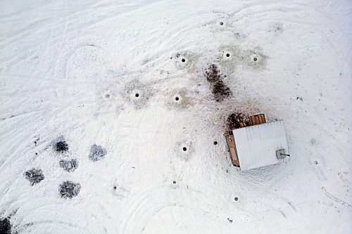 09012023
Ice-fishing holes outside a shack at the south end of Minnedosa Lake on a grey Monday.
(Tim Smith/The Brandon Sun)