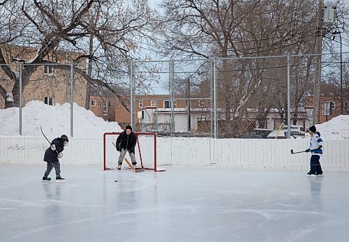 JESSICA LEE / WINNIPEG FREE PRESS

Aaron Henderson and his son, Eli, 10, play a pick-up game of hockey at Norwood Community Centre after school on January 9, 2023 with their new friend Joseph, 13 (in white).

Stand up
