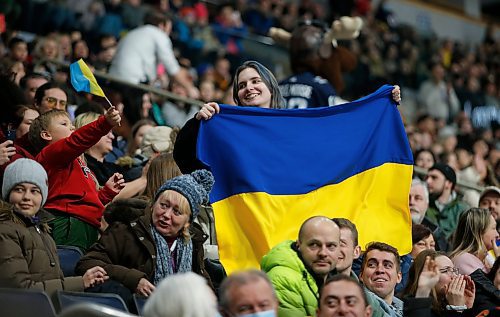 JOHN WOODS / WINNIPEG FREE PRESS
A person waves a Ukraine flag prior to the hockey game between the U of MB Bisons and Ukraine in Winnipeg on Monday, January 9, 2023.