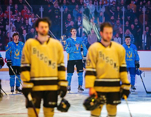 JOHN WOODS / WINNIPEG FREE PRESS
Ukraine players sing their national anthem as U of MB Bisons listen before first period action in Winnipeg on Monday, January 9, 2023.