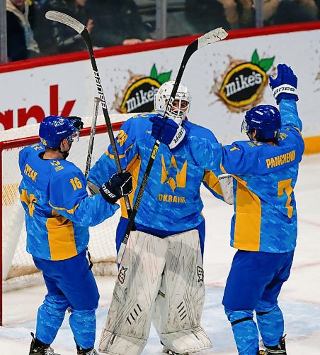 JOHN WOODS / WINNIPEG FREE PRESS
Ukraine's goaltender Bogdan Diachenko (20), Ivan Sysak (16) and Yaroslav Panchenko (7) celebrate a win over the U of MB Bisons in Winnipeg on Monday, January 9, 2023.