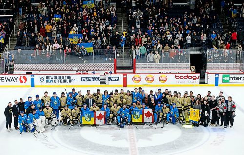 JOHN WOODS / WINNIPEG FREE PRESS
U of MB Bisons and Ukraine and fans gather for a photo  after a game in Winnipeg on Monday, January 9, 2023.