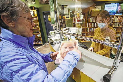 MIKE DEAL / WINNIPEG FREE PRESS
Tannis Thompsett purchases Prince Harry's memoire, Spare, at McNally Robinson GrantPark Tuesday afternoon. 
See Ben Sigurdson story
230110 - Tuesday, January 10, 2023.